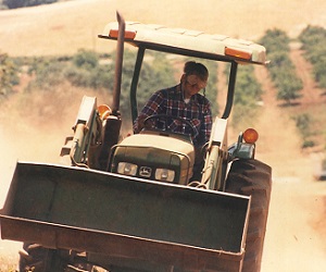Jim Bernau clearing the land in the early 1980s