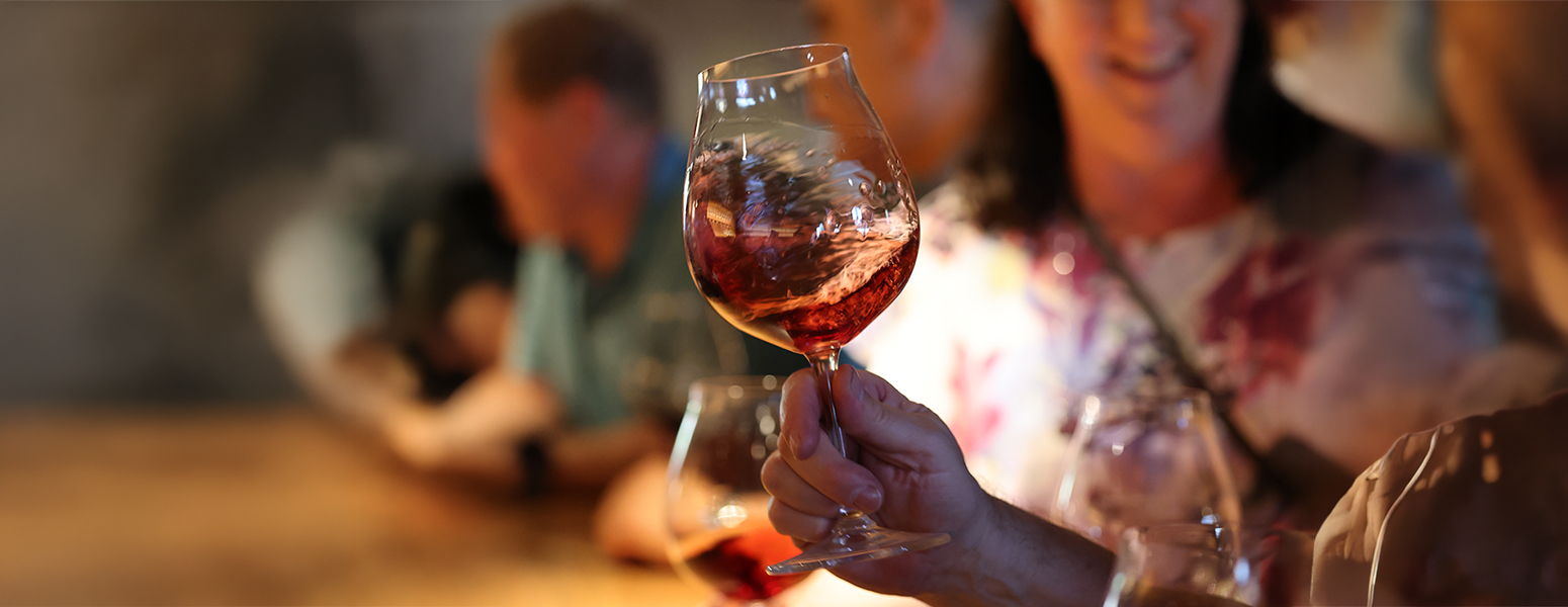 place setting with forks and knifes, menu and wine glasses